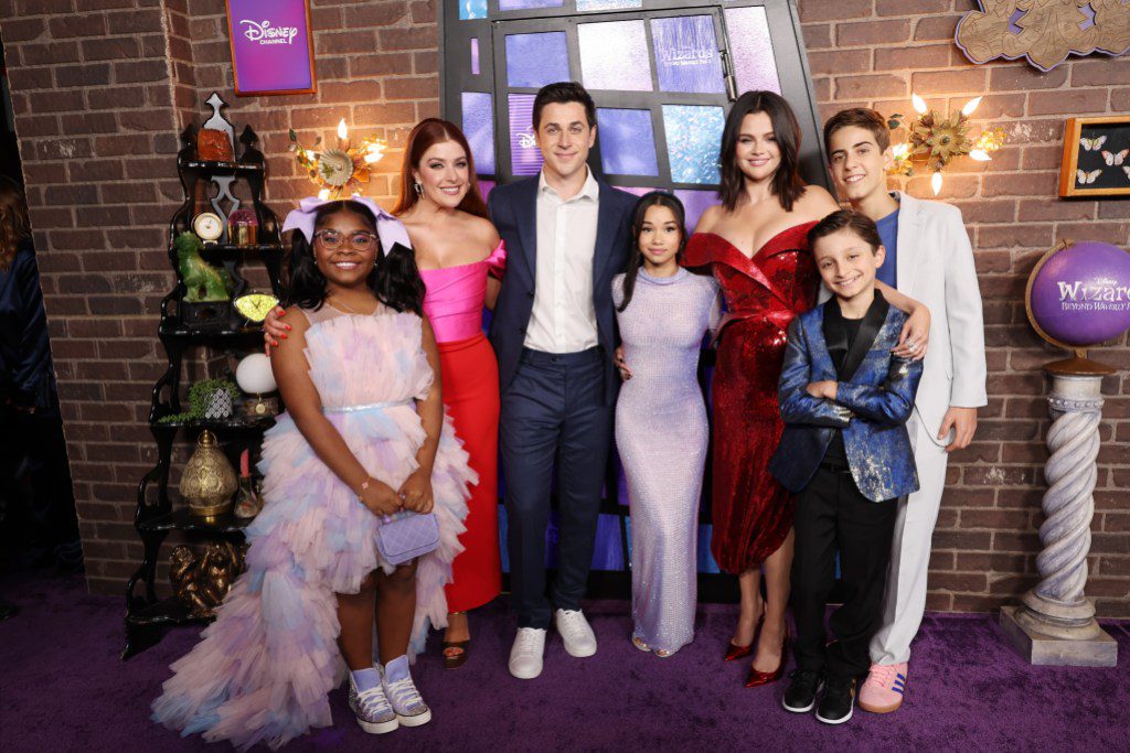 LOS ANGELES, CALIFORNIA - OCTOBER 28: (L-R) Taylor Cora, Mimi Gianopulos, David Henrie, Janice LeAnn Brown, Selena Gomez, Max Matenko and Alkaio Thiele attend the World Premiere of Disney's 